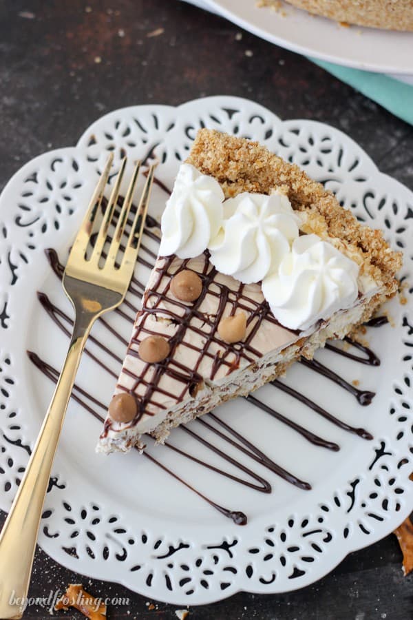 This No-Bake Chubby Hubby Pie is a vanilla malt filling with chocolate covered pretzels, peanut butter chips and a hot fudge swirl. The salty pretzel crust is the perfect compliment for this sweet pie.