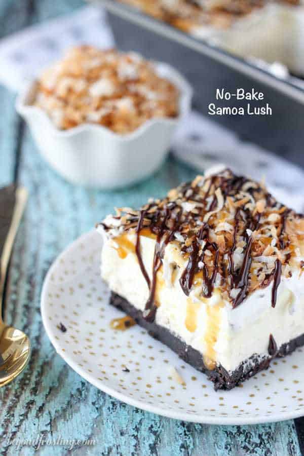 This No-Bake Samoa lush is an icebox cake featuring an Oreo cookie crust, a layer of caramel cheesecake, coconut mousse and a whipped cream topped with caramel, hot fudge and toasted coconut