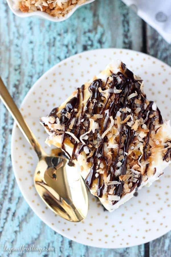 Summer time is the perfect time for no-bake icebox cakes! This No-Bake Samoa Lush Desserts is layers and layers of awesome. It is an Oreo cookie crust, a layer of caramel cheesecake, coconut mousse and a whipped cream topped with caramel, hot fudge and toasted coconut.