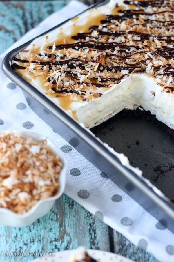 Summer time is the perfect time for no-bake icebox cakes! This No-Bake Samoa Lush Desserts is layers and layers of awesome. It is an Oreo cookie crust, a layer of caramel cheesecake, coconut mousse and a whipped cream topped with caramel, hot fudge and toasted coconut.