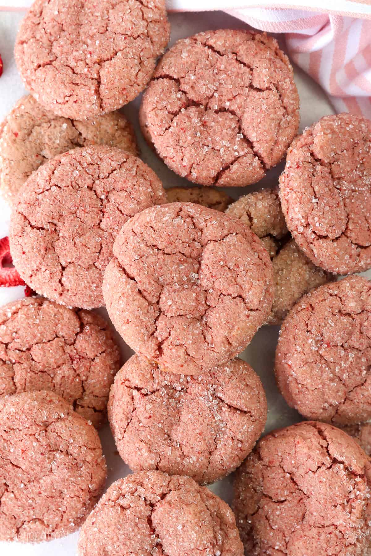 Overhead view of assorted strawberry cake mix cookies.