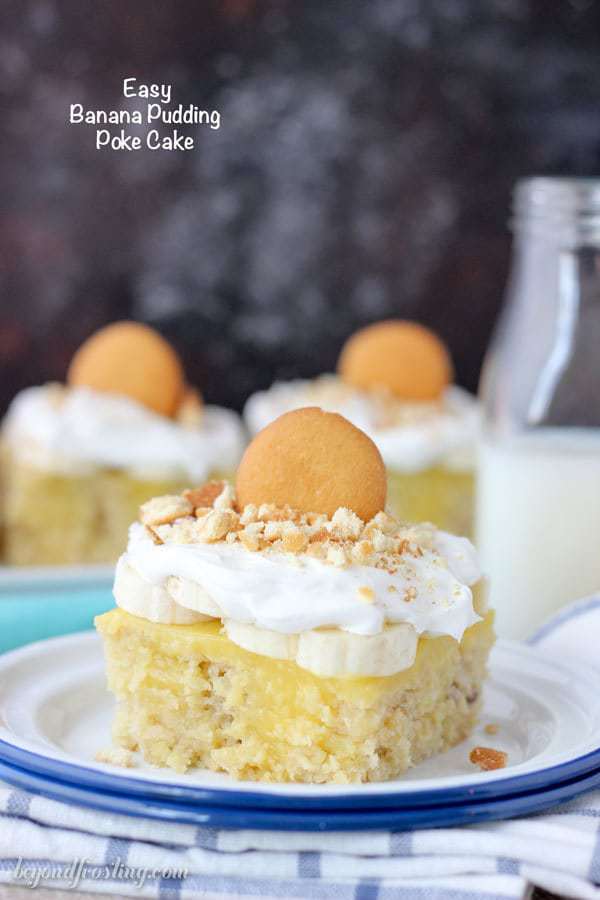 This Easy Banana Pudding Poke Cake is outrageously amazing. It is a doctored cake mix with banana, brown sugar and buttermilk filled with vanilla pudding and topped with fresh sliced bananas, whipped cream and crushed vanilla wafer cookies.