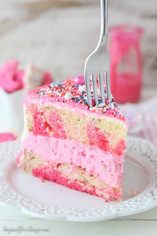 How fun is this Circus Animal Cookie Cake? This cake is layers of vanilla cake, vanilla frosting and Circus Animal Cookies with a pink chocolate ganache. There’s a lot of pink and definitely some sprinkles.