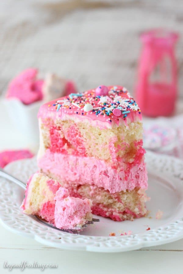 How fun is this Circus Animal Cookie Cake? This cake is layers of vanilla cake, vanilla frosting and Circus Animal Cookies with a pink chocolate ganache. There’s a lot of pink and definitely some sprinkles.