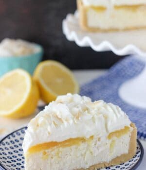 a slice of lemon and coconut cheesecake on a blue polka dot plate