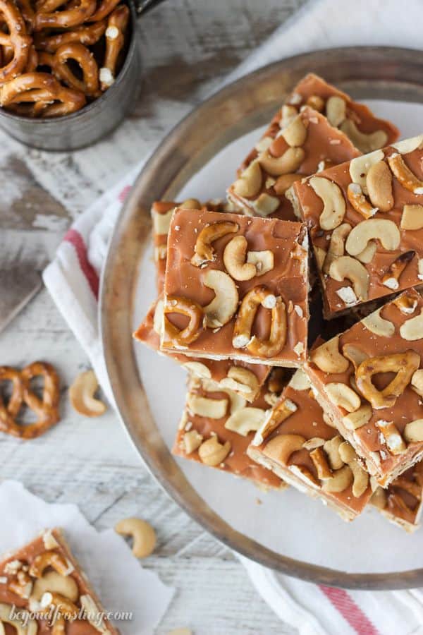 Salty meets sweet in these No-Bake Butterscotch Bars. Layers of peanut butter, pretzels, butterscotch ganache and salty cashews. These bars are a great snack!