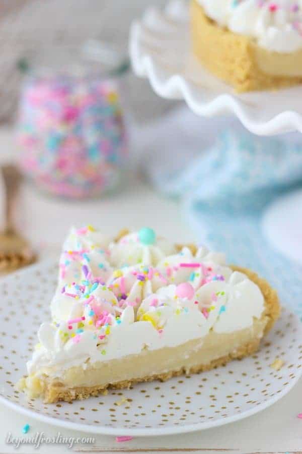 This homemade Funfetti Pudding Pie is a cake batter lover’s dream. The from-scratch Funfetti pudding is topped with a cake batter whipped cream. This pie is insanely delicious.