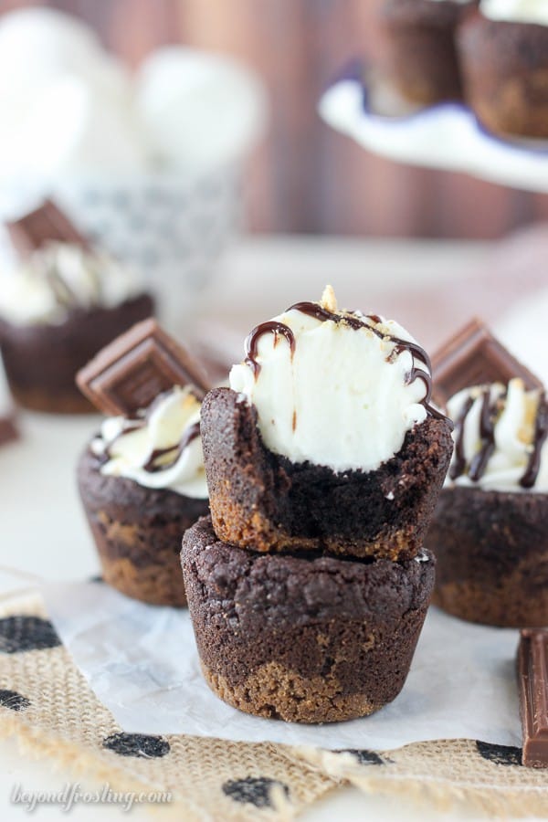 Celebrate National S’mores Day with these S'mores Cream Pie Cookie Cups. These cookies have an Oreo cookie crust with a soft chocolate pudding cookie, filled with a marshmallow mousse and topped with chocolate.