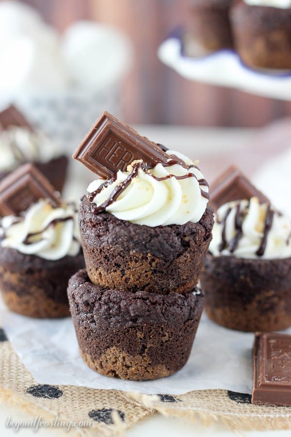 Celebrate National S’mores Day with these S'mores Cream Pie Cookie Cups. These cookies have an Oreo cookie crust with a soft chocolate pudding cookie, filled with a marshmallow mousse and topped with chocolate.