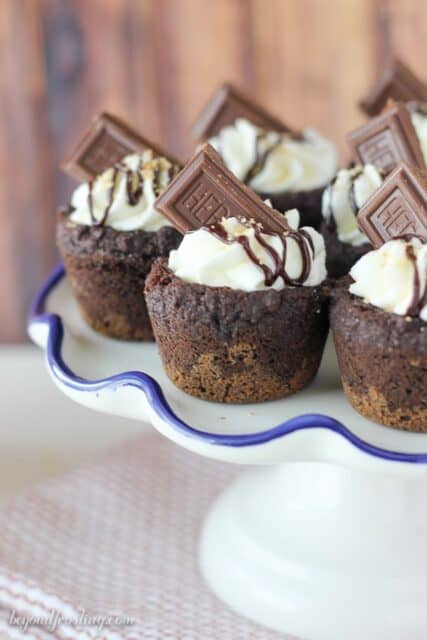 These S'mores Cream Pie Cookie Cups have an Oreo cookie crust with a soft chocolate pudding cookie, filled with a marshmallow mousse and topped with chocolate.