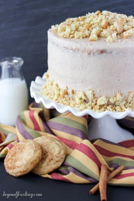 This Snickerdoodle Cookie Cake is all about the cinnamon sugar flavor combination you love. A swirled streusel cake with a brown sugar cinnamon frosting and topped with crushed snickerdoodle cookies.