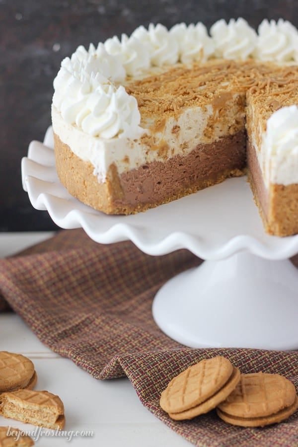 No- Bake Chocolate Peanut Butter Mousse Pie: a Nutter Butter cookie crust with a thick layer of chocolate mousse, a layer of peanut butter cookie mousse and topped with whipped cream and more peanut butter. Each layer is light and airy just like you would expect for a mousse.