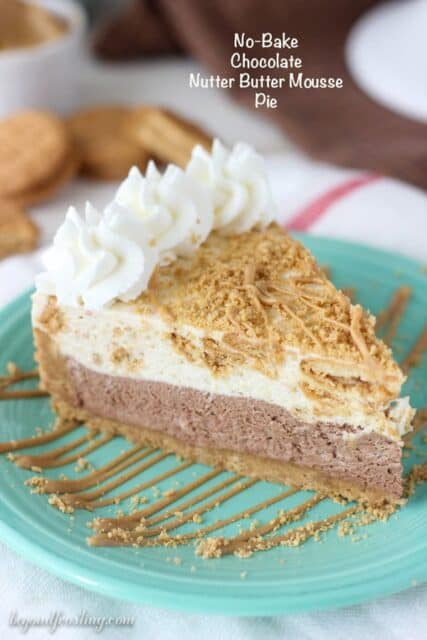 This No-Bake Chocolate Nutter Butter Mousse Pie is a Nutter Butter cookie crust with a thick layer of chocolate mousse, a layer of peanut butter cookie mousse and topped with whipped cream and more peanut butter.