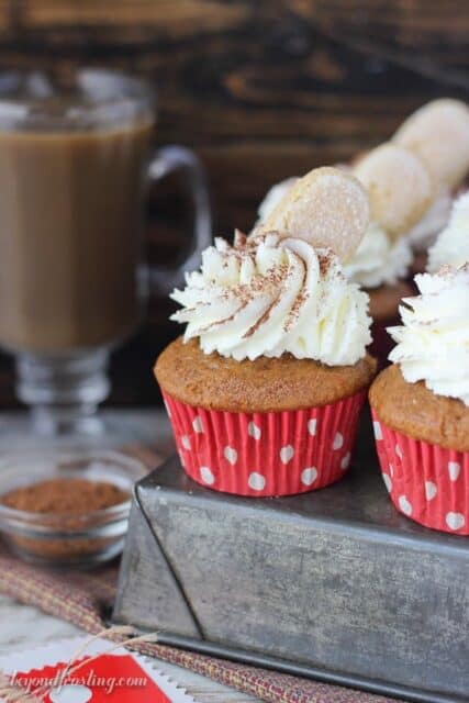 Pumpkin Tiramisu Cupcakes are the most popular fall cupcakes. This spiced pumpkin cupcake is soaked with espresso and bourbon and filled with a pumpkin mascarpone mousse. These are topped with a mascarpone whipped cream, cocoa powder and a ladyfinger.