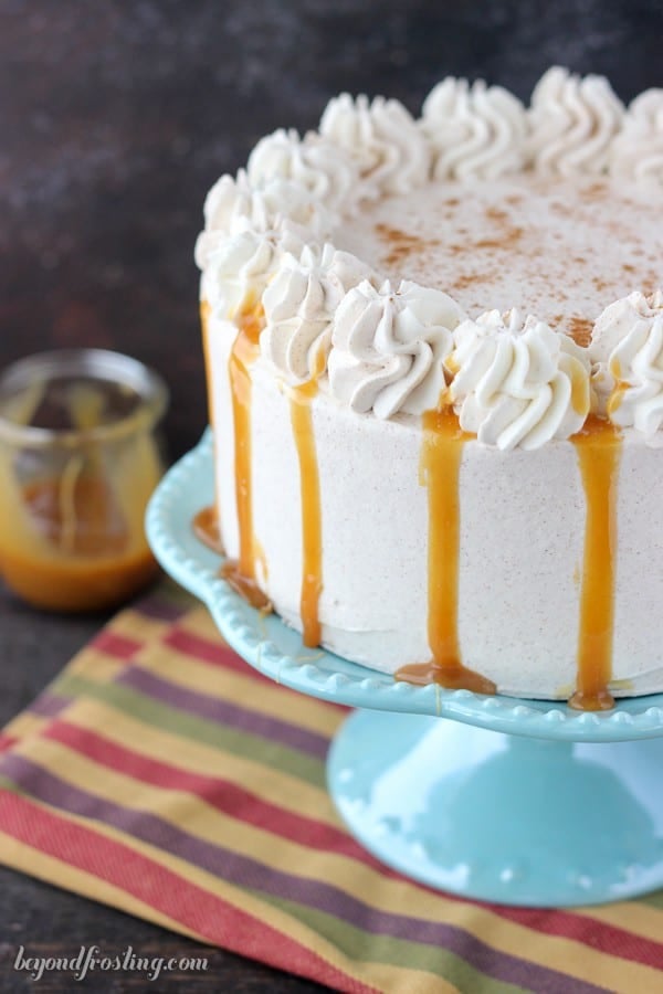 Cake and ice cream never looked so good. This Pumpkin Ice Cream Cake is a double layer pumpkin cake with a no-churn pumpkin ice cream. This cake is topped with a cinnamon maple whipped cream.