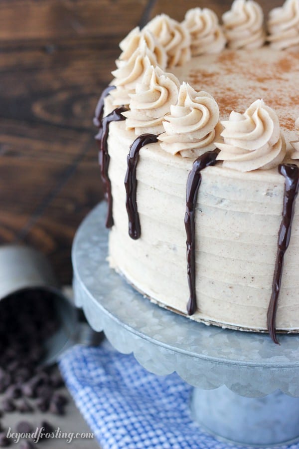 Frosted cake on a cake stand.