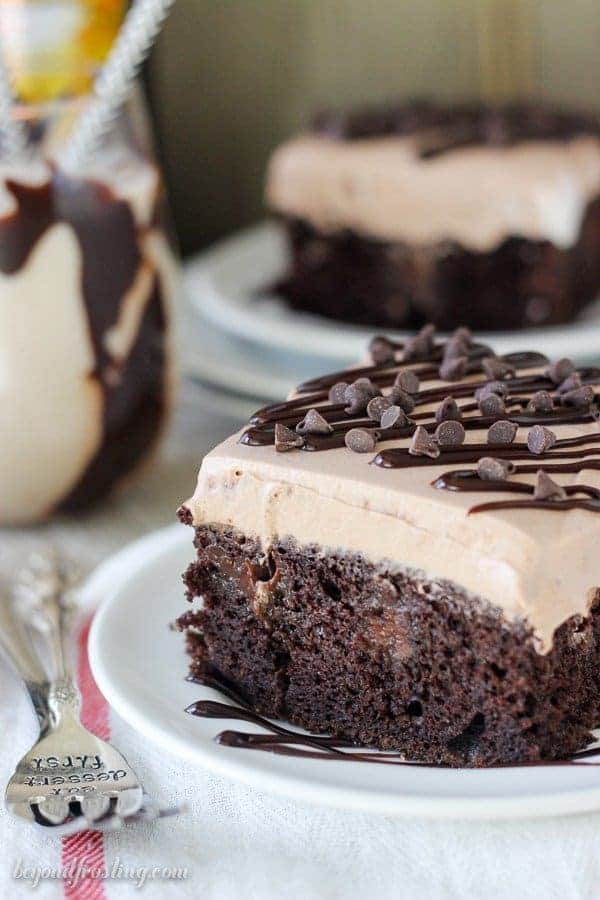 This Mudslide Poke Cake is loaded with Bailey’s and Kahlua and plenty of chocolate. It’s a dark chocolate cake soaked in a spiked chocolate ganache, Kahlua Chocolate Pudding and a spiked chocolate mousse on top.