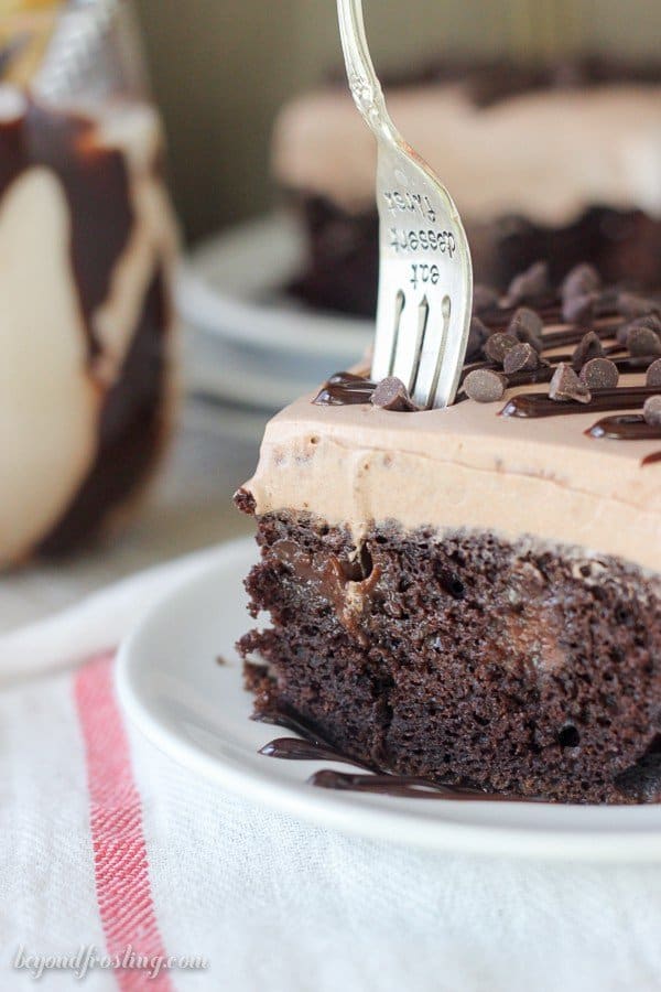 This Mudslide Poke Cake is a dark chocolate cake soaked in a spiked chocolate ganache, Kahlua Chocolate Pudding and a spiked chocolate mousse on top. You’re favorite mudslide cocktail just got even better.