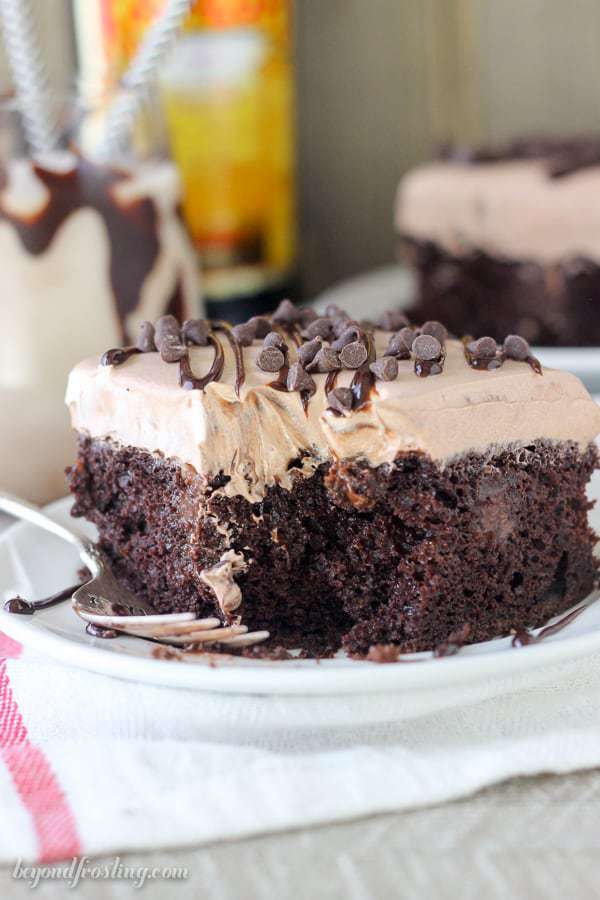 This Mudslide Poke Cake is a dark chocolate cake soaked in a spiked chocolate ganache, Kahlua Chocolate Pudding and a spiked chocolate mousse on top. There’s plenty of chocolate and booze to go around.