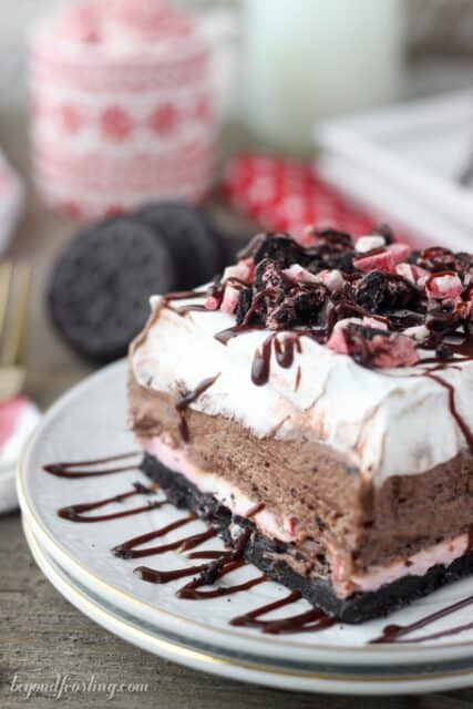 This Peppermint Oreo Lush is the perfect combination of chocolate and peppermint in a no-bake layered desserts. The crust is made with Peppermint Oreo, followed by a no-bake peppermint cheesecake, a chocolate mousse and it’s finished with whipped cream.