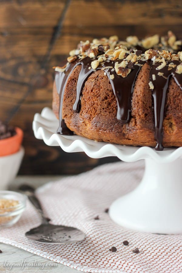 This Pumpkin Seven Layer Bundt Cake is cake is stuffed with walnuts and chocolate chips and finished with a decadent chocolate ganache and shredded coconut. It’s inspired by my favorite seven layer bars, but with pumpkin!