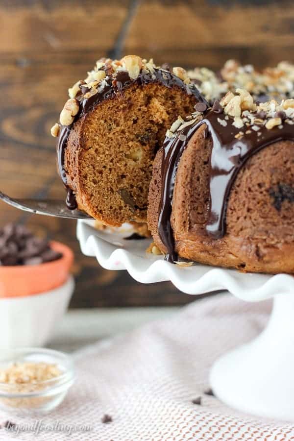 This Pumpkin Seven Layer Bundt Cake is inspired by my favorite seven layer bar, but packed into a pumpkin spice cake. The cake is stuffed with walnuts and chocolate chips and finished with a decadent chocolate ganache and shredded coconut.