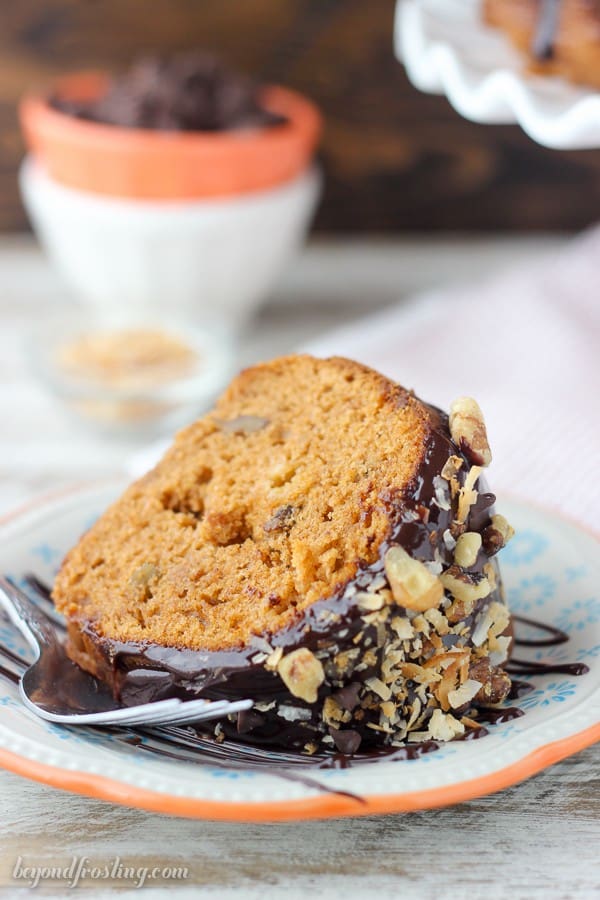 This Pumpkin Seven Layer Bundt Cake is inspired by my favorite seven layer bar, but packed into a pumpkin spice cake. The cake is stuffed with walnuts and chocolate chips and finished with a decadent chocolate ganache and shredded coconut.