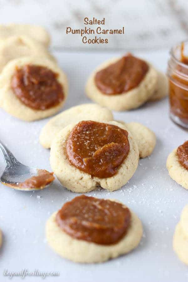 These Salted Pumpkin Caramel Cookies are a soft buttery thumbprint cookie filled with a homemade salted pumpkin caramel filling.