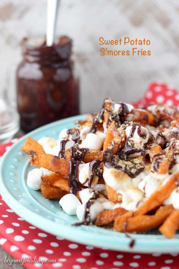 Ooey Gooey Sweet Potato S’mores Fries. Layers of crispy sweet potato fries & melted marshmallow drizzled with chocolate and crushed graham crackers. This sweet potato dessert is perfect for your next party!