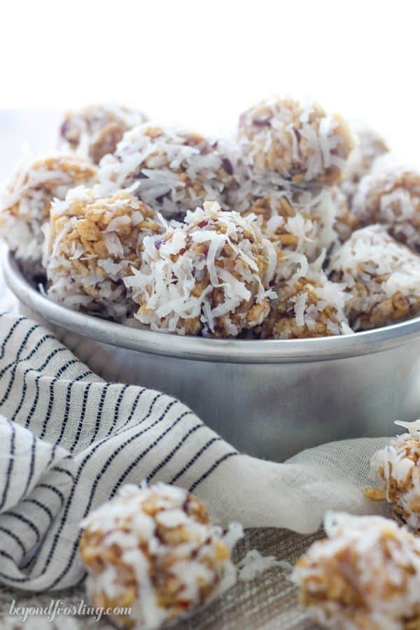 A close up shot of a vintage cake pan filled with coconut balls