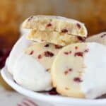 Soft and buttery almond shortbread cookies loaded with sweetened cranberries and dipped in white chocolate.