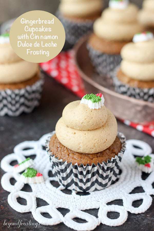 Frosted Gingerbread Cupcakes on a plate and white doily. 
