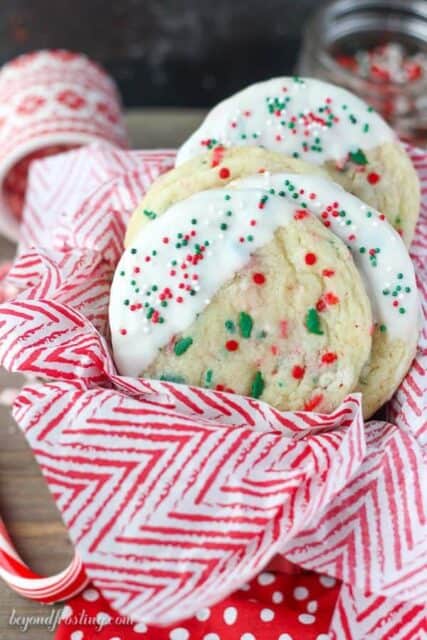 Soft and buttery sugar cookies with a peppermint crunch. These white chocolate dipped peppermint cookies are perfect for the holidays.