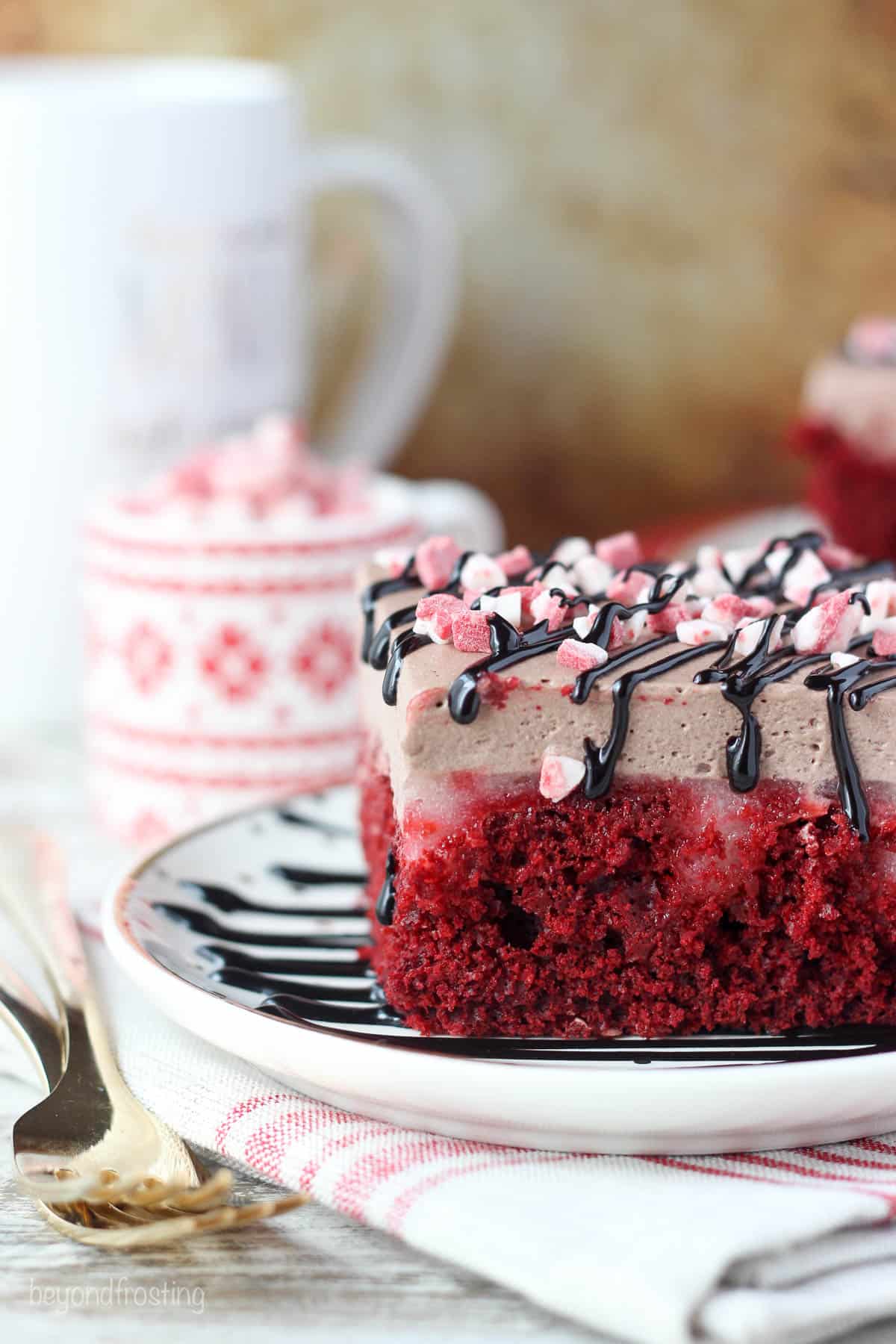 I am loving this Peppermint Hot Chocolate Poke Cake. A peppermint red velvet cake soaked in a white chocolate peppermint pudding and topped with hot chocolate whipped cream.