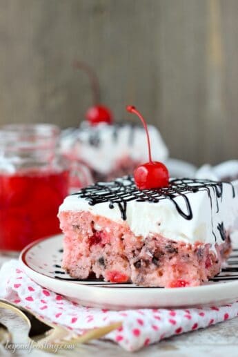 Fluffy Cherry Chocolate Chip Poke Cake Recipe | Beyond Frosting