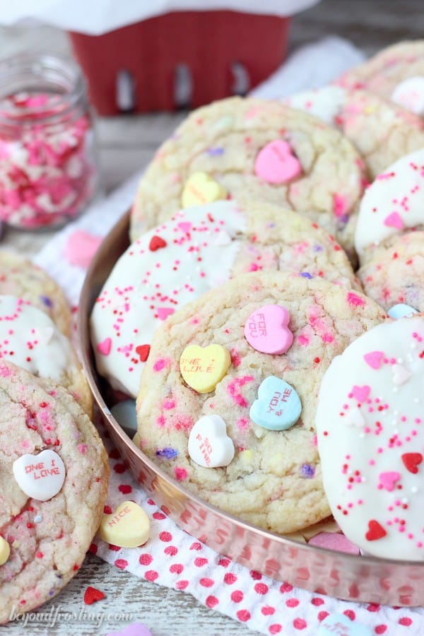 Say hello with these Conversation Heart Sugar Cookies. There’s plenty to love in these giant soft and buttery cookies that are filled with crushed conversation heart candies.