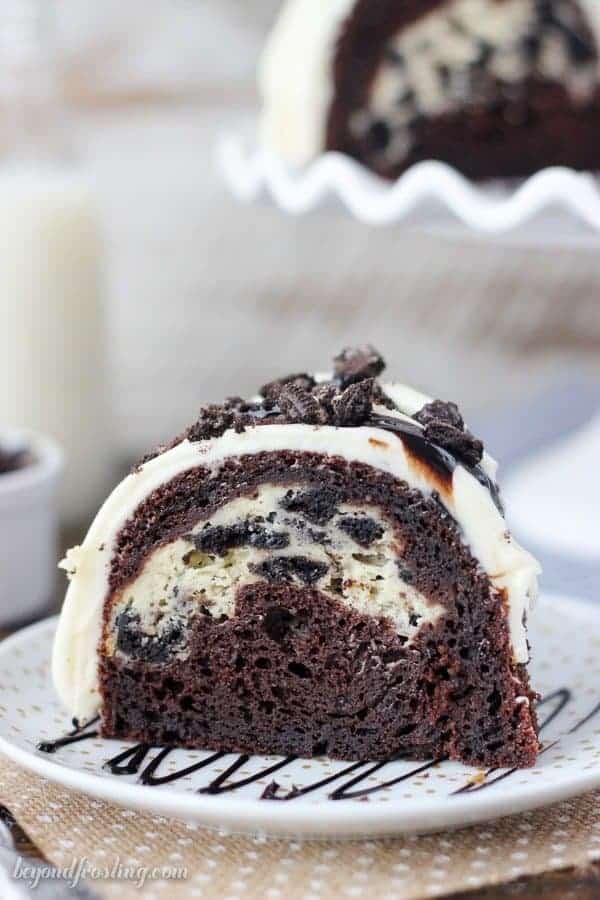 This Oreo Chocolate Cheesecake Cake is a chocolately bundt cake with an Oreo cheesecake filling and it’s topped with a cream cheese glaze and more Oreos.