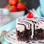 Everybody wants a slice of this Strawberry Milkshake Poke Cake. This chocolate cake is drenched in sweetened condensed milk and topped with a strawberry whipped cream.