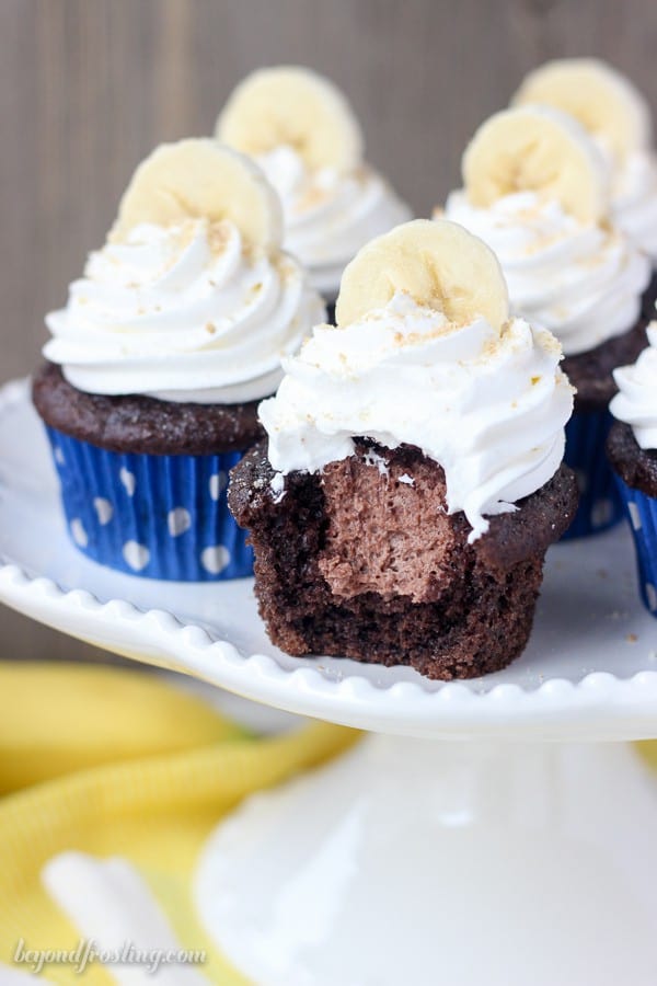 Mouthwatering Chocolate Banana Cupcakes filled with an easy chocolate mousse and topped with whipped cream, bananas and Nilla Wafer. These Chocolate Banana Cream Pie Cupcakes are a show stopper.
