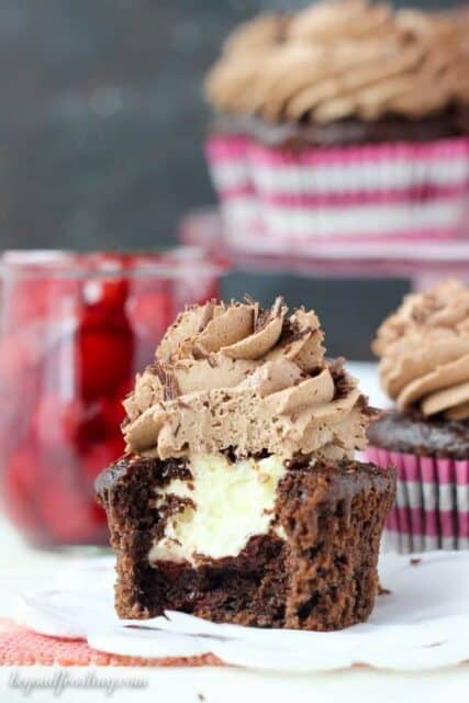 Just one bite is all you need to fall in love with these Chocolate Cherry Cream Pie Cupcakes. These chocolate cupcakes are baked with cherry pie filling, filled with a cheesecake mousse and they’re topped with chocolate whipped cream.