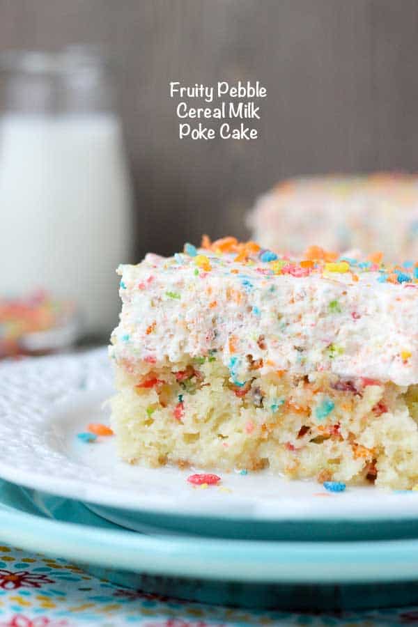 Fruity Pebble Cereal Milk Poke Cake on a Plate Near a Glass of Milk