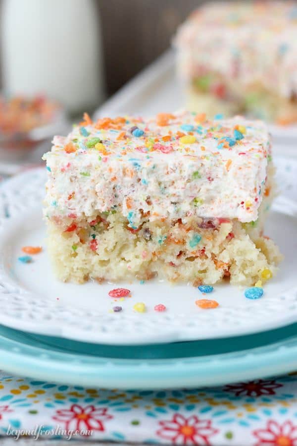 Fruity Pebble Cereal Milk Poke Cake - Beyond Frosting