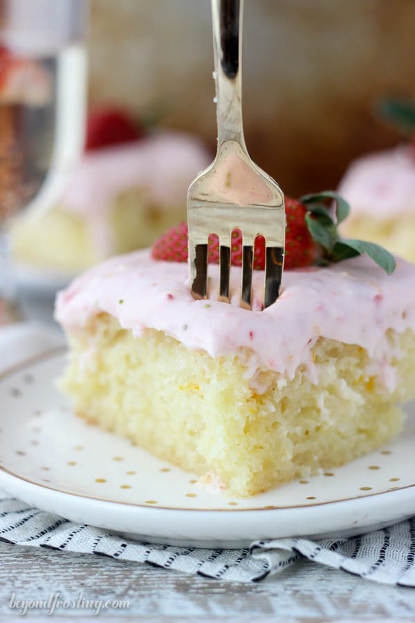 An orange infused champagne cake soaked in a buttery champagne glaze and topped with a strawberry cream cheese frosting. You’ll be asking for seconds with this Strawberry Champagne Cake.