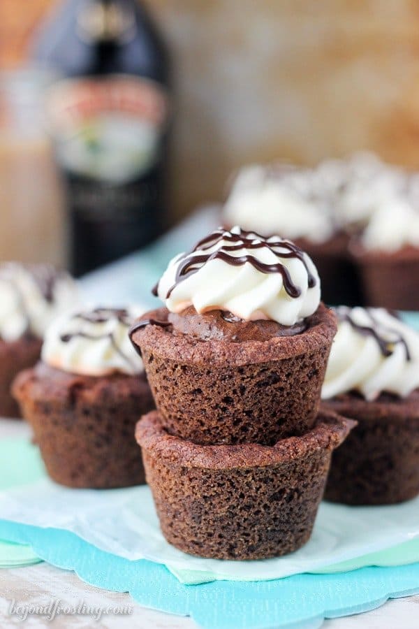 Two stacked cookie cups with a mousse filling and whipped topping