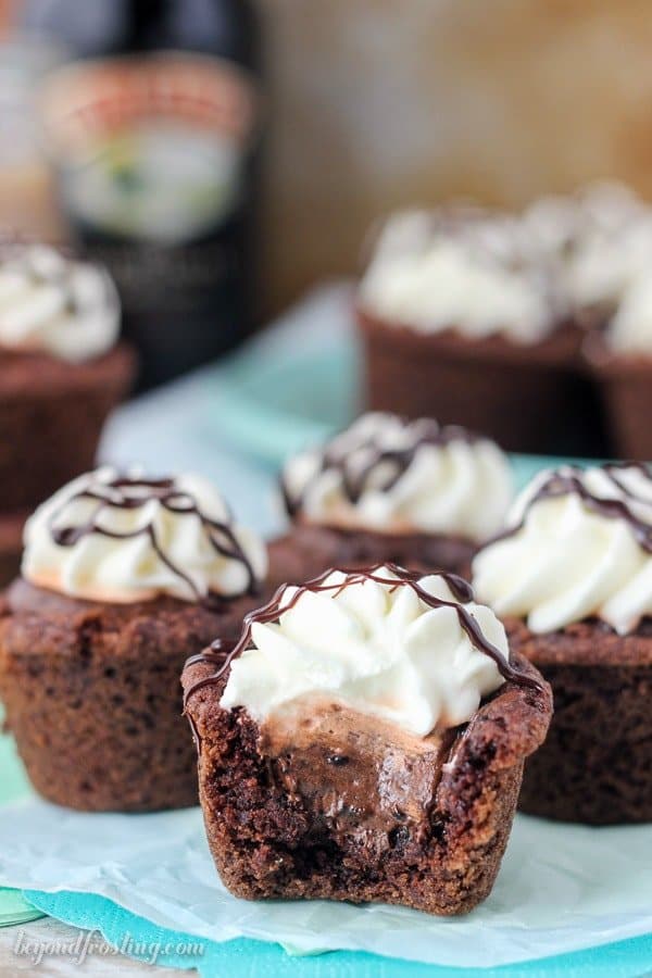 A gorgeous chocolate cookie cup with a bite missing showing the mousse filling