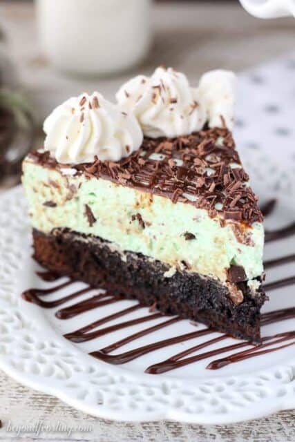 A slice of Brownie Bottom Mint Chip Mousse Pie on a white plate