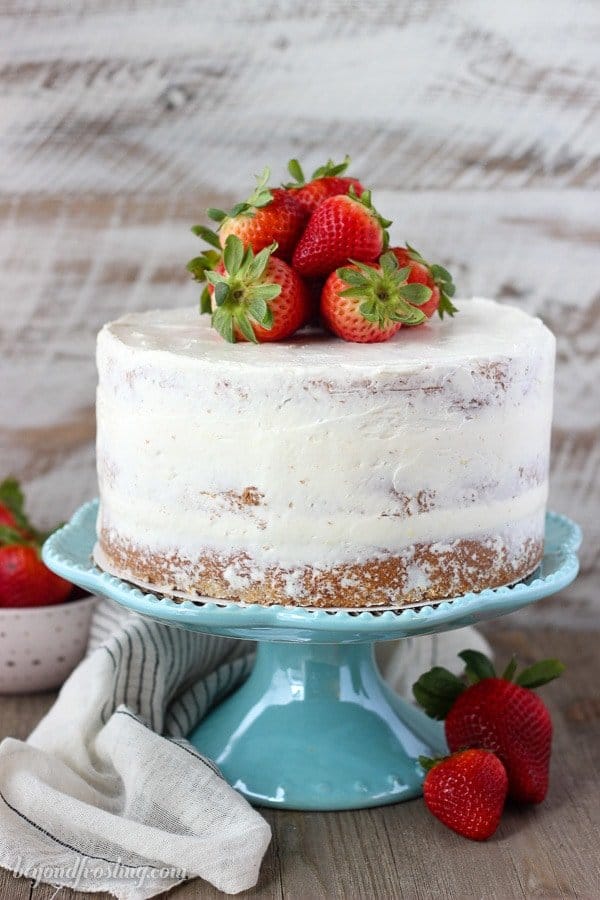 This fresh homemade Strawberry Cake is covered with a lemon Swiss Meringue Buttercream. The cake is incredibly moist and bursting with fresh strawberry flavor.