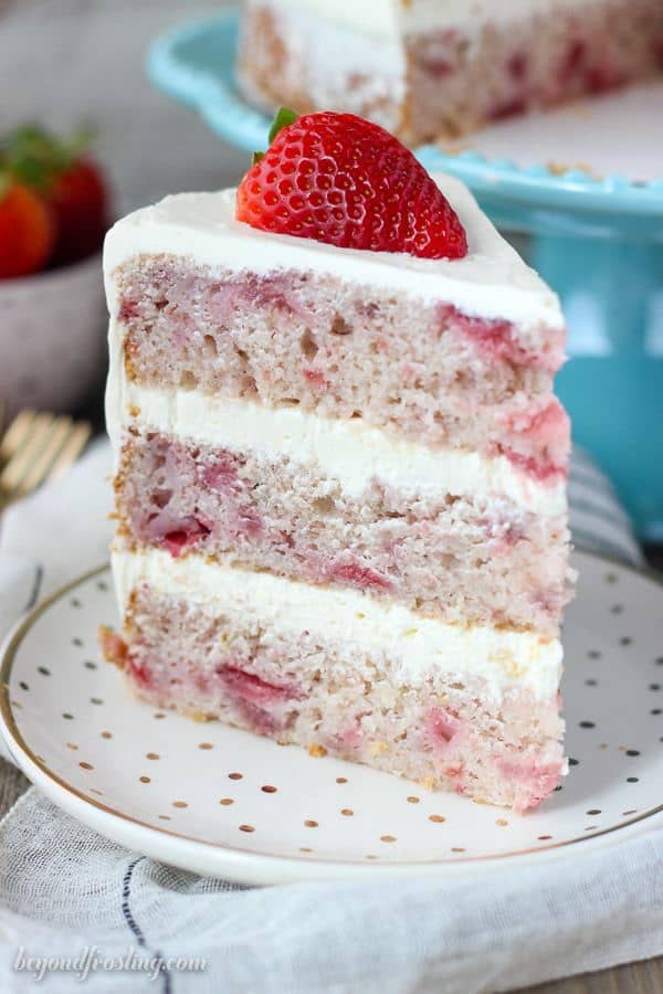 This fresh homemade Strawberry Cake is covered with a lemon Swiss Meringue Buttercream. The cake is incredibly moist and bursting with fresh strawberry flavor.