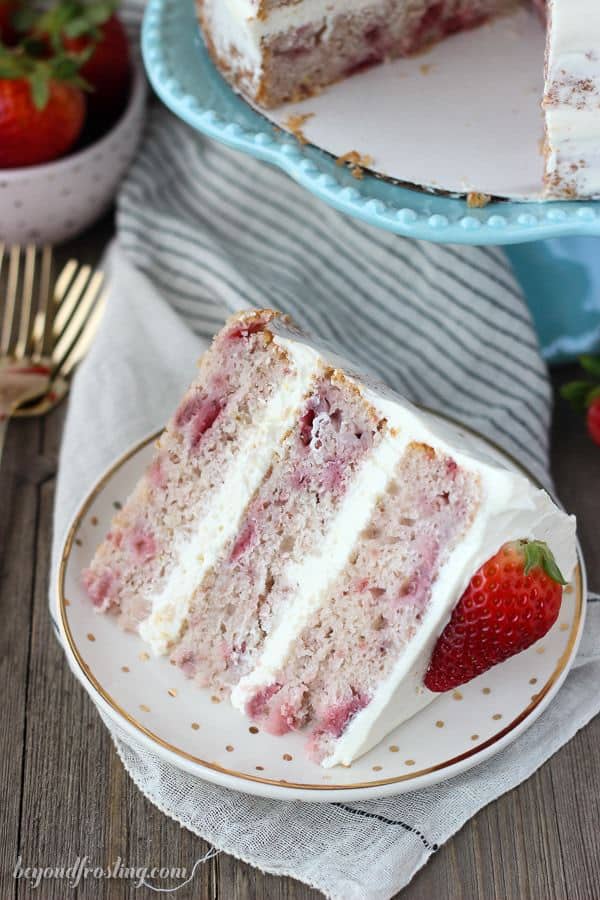 You’ll love this fresh Homemade Strawberry Cake. With three different types of strawberry flavors, this is the ultimate spring cake! It’s filled with a lemon Swiss Meringue Buttercream.