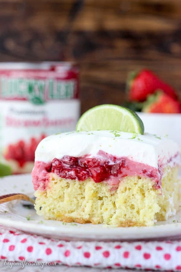 This Strawberry Margarita Cake is a lime infused, tequila-spiked cake with a layer of strawberry mousse and it’s topped with whipped cream and more lime zest.